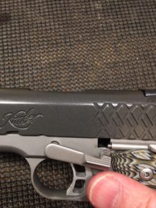 Line up the notch in the slide with the square hole in the frame.