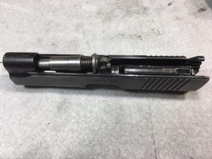 Place the Slide Upside Down and Remove the Guide Rod, Recoil Spring and Barrel