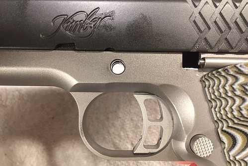 How to Reassemble a 1911-Line Up the Barrel Lug with the Hole in the Frame