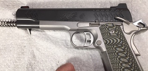 How to Reassemble a 1911-move the slide all the way forward and lock it there with the safety lever