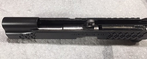 How to reassemble a 1911-Place the barrel into the slide