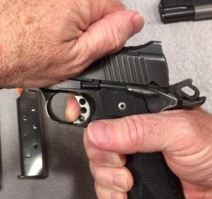 1911 Function and Safety Check-Press trigger while holding the slide back one half inch