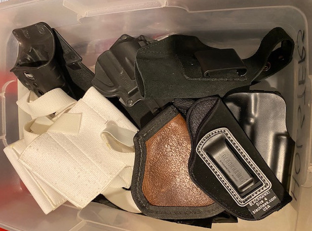 Bin of worthless cheap holsters