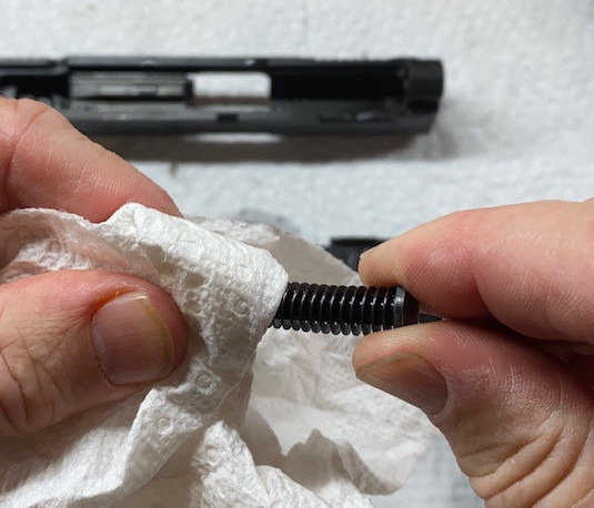 Clean the recoil spring and guide rod assembly