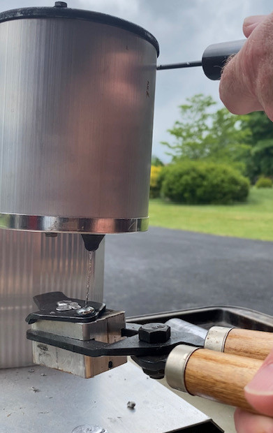 Filling the Bullet mold with Molten Lead