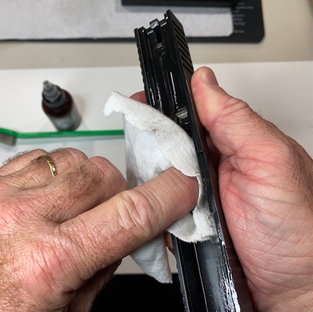 How to Field Strip & Clean a Glock 17 9mm or Glock 19 9mm Pistol: After letting the gun oil work for at lease 5 minutes, wipe it clean using a cotton cloth