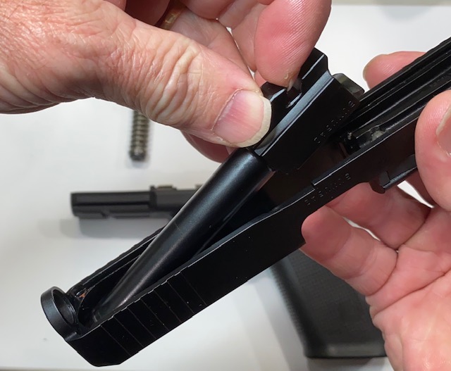 How to Field Strip & Clean a Glock 17 9mm or Glock 19 9mm Pistol: Lift and remove the barrel