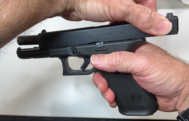 How to Field Strip & Clean a Glock 17 9mm or Glock 19 9mm Pistol: Lock the slide to the rear