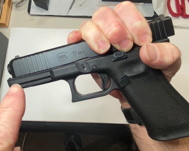 How to Field Strip & Clean a Glock 17 9mm or Glock 19 9mm Pistol: Move the slide slightly to the rear about a quarter of an inch