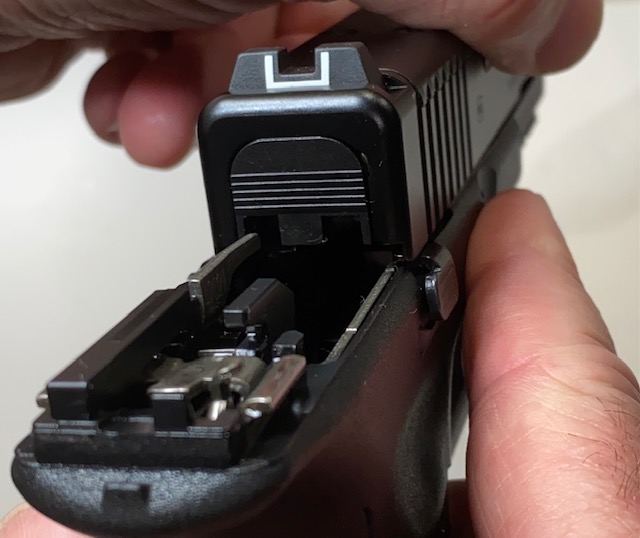 How to Field Strip & Clean a Glock 17 9mm or Glock 19 9mm Pistol: Move the slide straight back slowly being careful not to let the Extractor scratch the rear of the slide