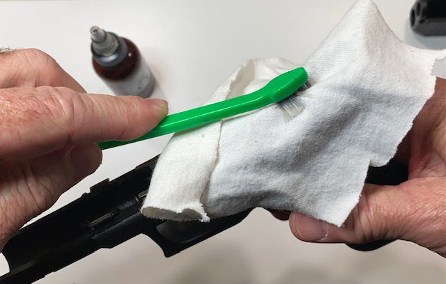 Use the gun brush to force the cloth into the tight spots