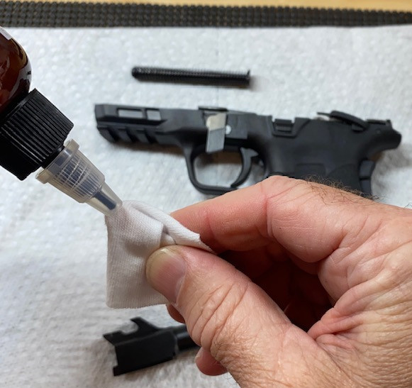 Apply Original Gun Oil or solvent to the patch
