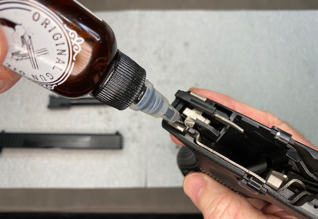 Glock Lubrication Guide: Apply 1 drop of oil to the rear of the Glock frame where trigger bar contacts the connector