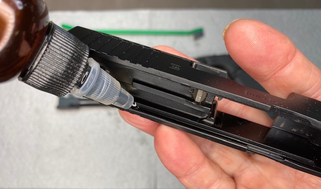 Glock Lubrication Guide: Apply One drop of oil in each Glock slide Cut
