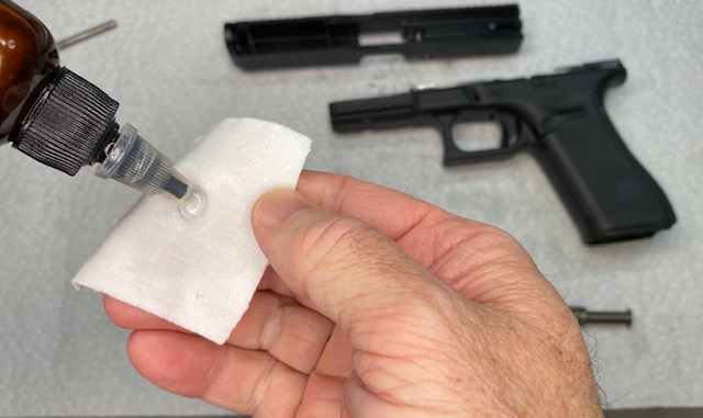 Glock Lubrication Guide: Dampen a cloth slightly with oil