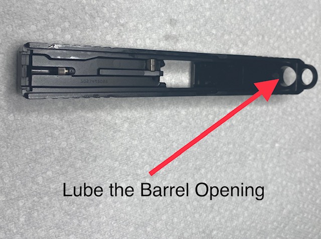 Glock Lubrication Guide: Glock Lubrication Point. Wipe the barrel opening in the slide with oil-dampened cloth