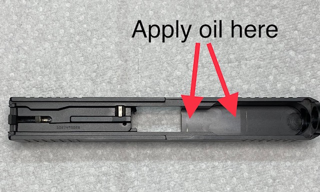 Glock Lubrication Point. Wipe the slide in front of the injection port with oil-dampened cloth