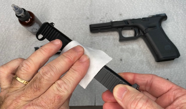 Lightly wipe down the entire exterior of the Glock Slide with oil-dampened cloth, then wipe with clean dry cloth to remove oil residue