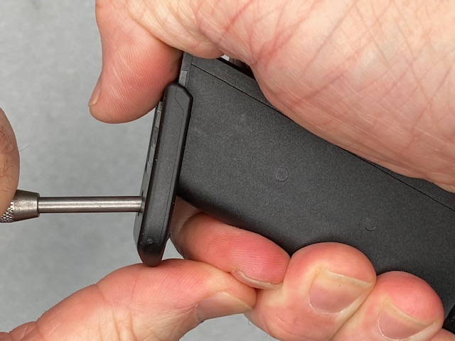 How To Remove a Glock Magazine Base Plate: Pull the punch almost all the way  out until only the very tip is still in the hole