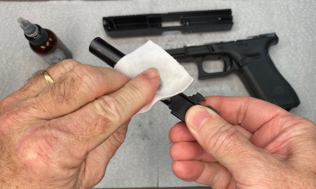 Wipe down the entire exterior of the Glock Barrel