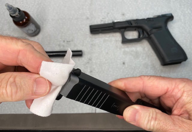 Glock Lubrication Guide: Wipe the Glock Slide Barrel Opening in the front of the slide as well