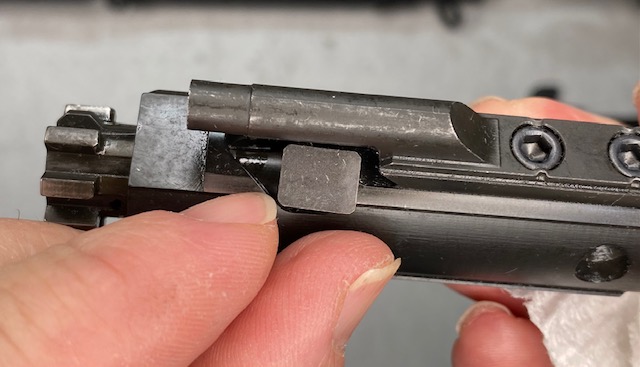 How to Disassemble & Clean An AR-15 Rifle: Cam Pin should be in the position shown