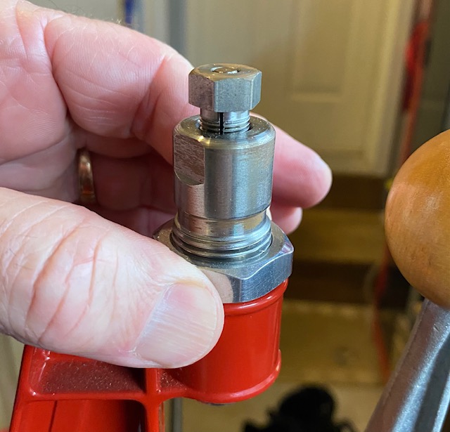 Once adjusted, tighten the locknut to hold it firmly in place