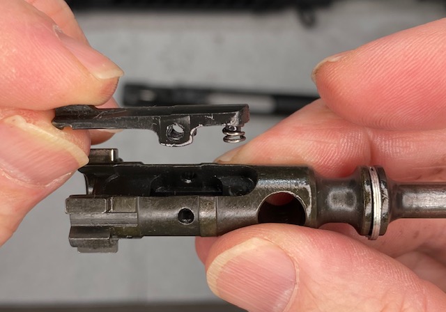 How to Disassemble & Clean An AR-15 Rifle: Remove the Extractor from the Bolt