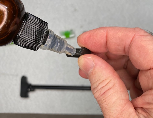 Apply a drop of oil to the Cam Pin