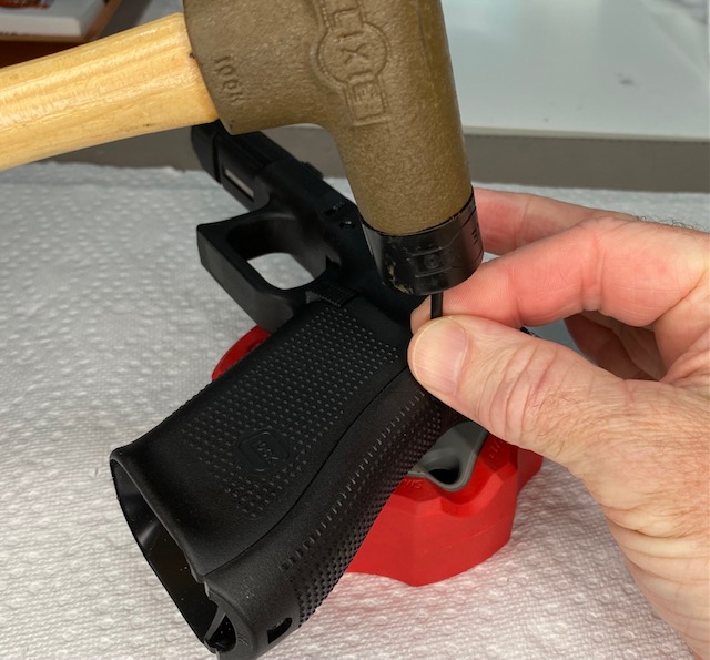 How to Install or How to Change a Glock Backstrap: If the pin is difficult to insert all the way, GENTLY tap it in with a soft head mallet.