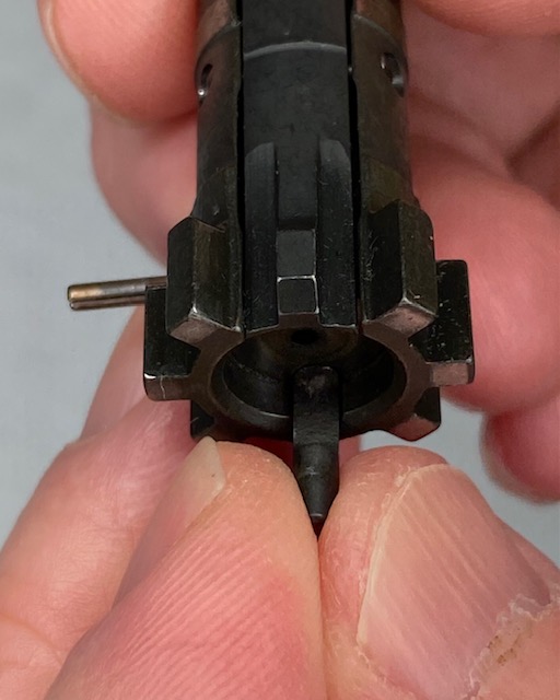 Insert the Ejector Plunger with the notch facing the center of the bolt as shown.