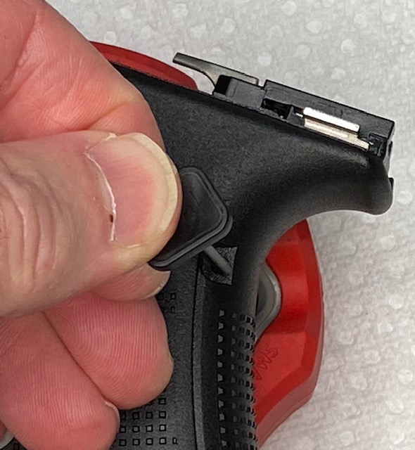 How to Install or How to Change a Glock Backstrap: Line up the Glock Pin tool with the Trigger housing Pin and gently push it down