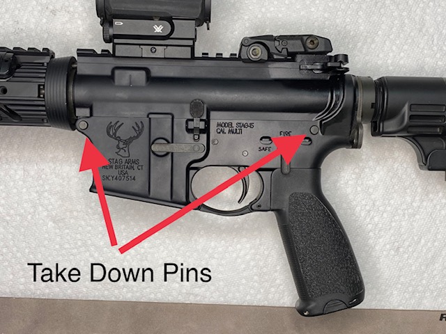 How to disassemble an AR-15: Location of the Take down Pins on left side of the rifle.