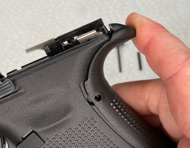 How to Install or How to Change a Glock Backstrap: Press the Beavertail part of the backstrap into the frame of the Glock until it clicks