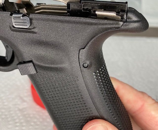 How to Install or How to Change a Glock Backstrap: Trigger Housing Pin (left side) after installing backstrap