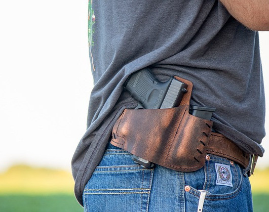 Firearms Legal Protection cost: man carrying a concealed weapon for self defense