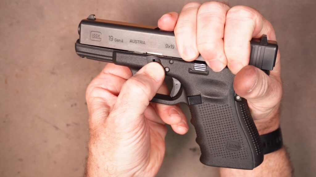 Snapshot_20260823225009 | Dave's Gun Maintenance, Gear Reviews, Training While holding the Glock slide slightly rearward, pull down on the take down levers