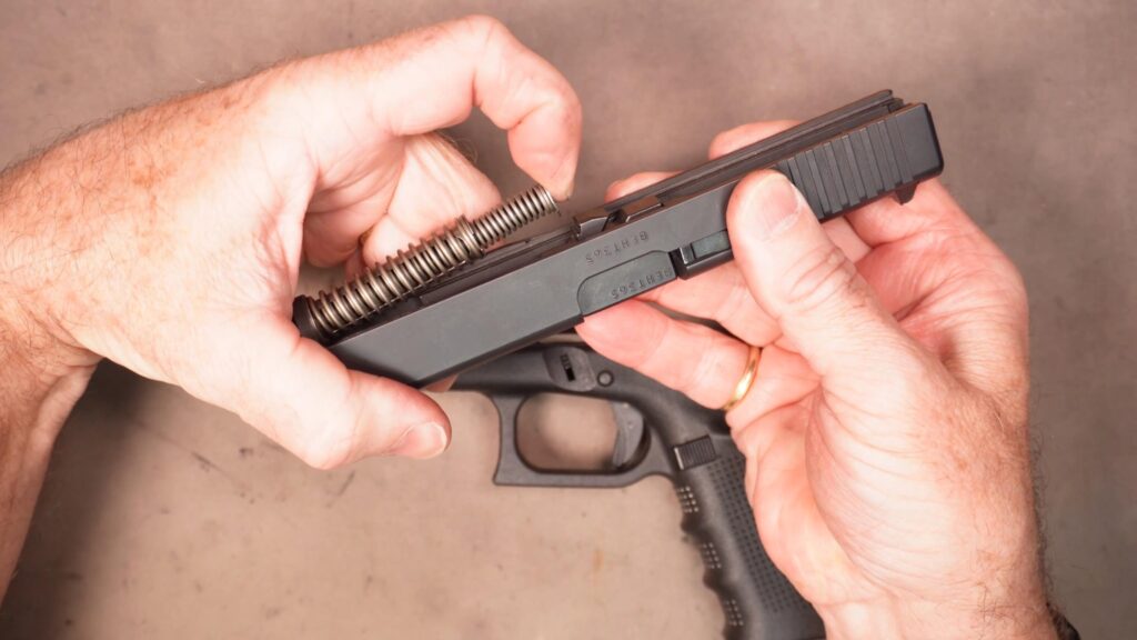Snapshot_20260823225049 | Dave's Gun Maintenance, Gear Reviews, Training Compress the recoil spring and pull the recoil spring and guide rod assembly out of the slide