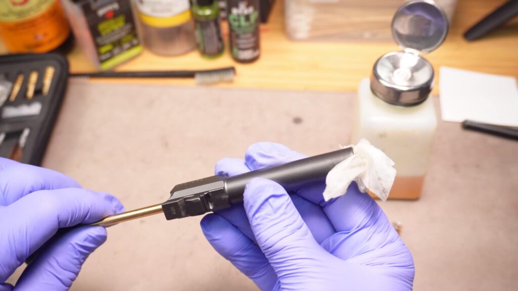 Use solvent, patches and a rod to clean the bore