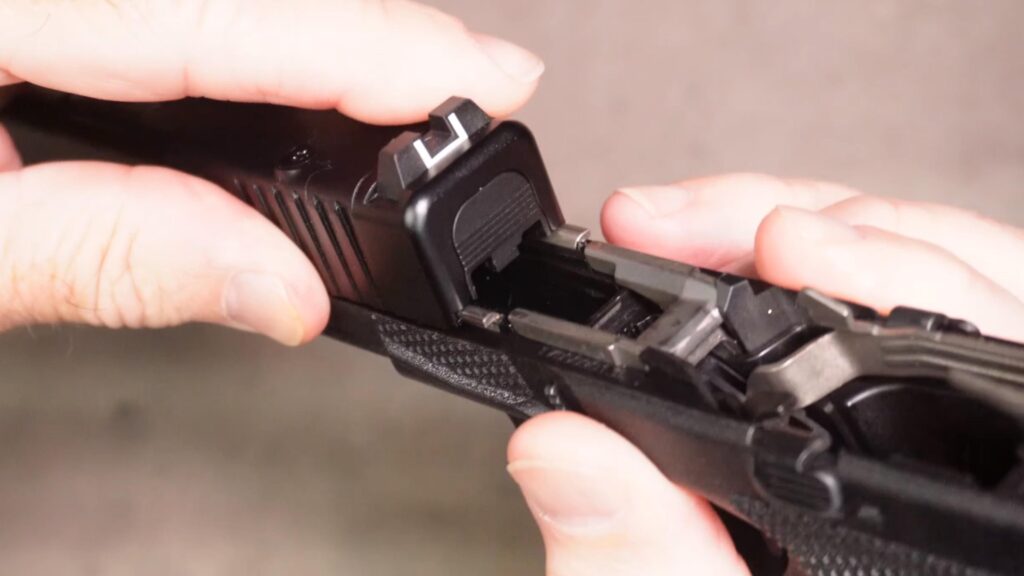 Install the slide back on the frame as shown