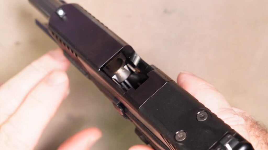 Verify the magazine is removed and the chamber is empty