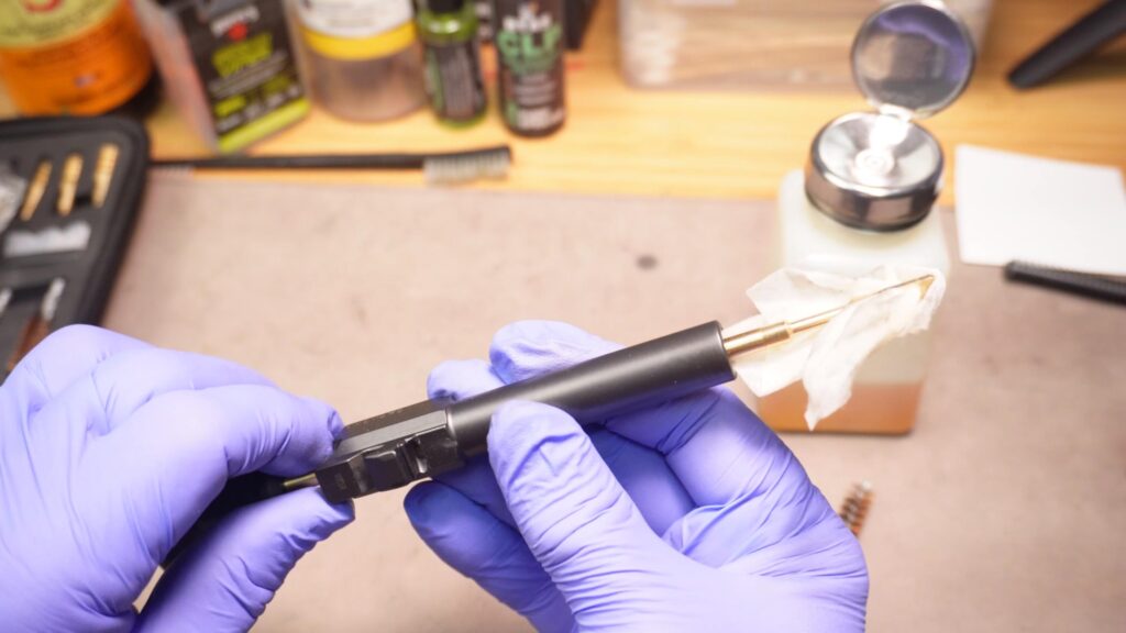 Clean the barrel bore with a rod, solvent, and patches