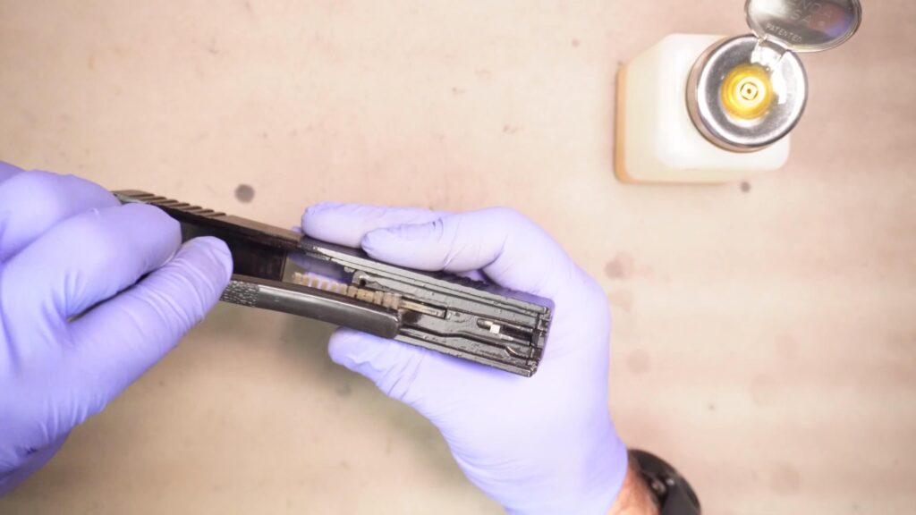 Clean the slide with solvent on a brush, then wipe down with a rag