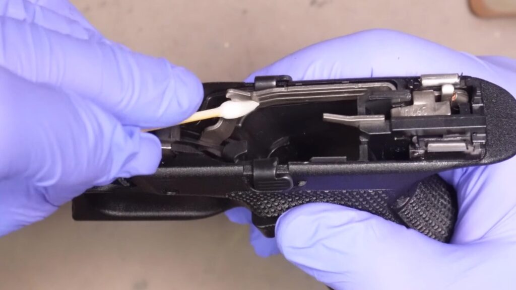 Clean the frame with solvent and cotton swabs, then wipe down with a rag