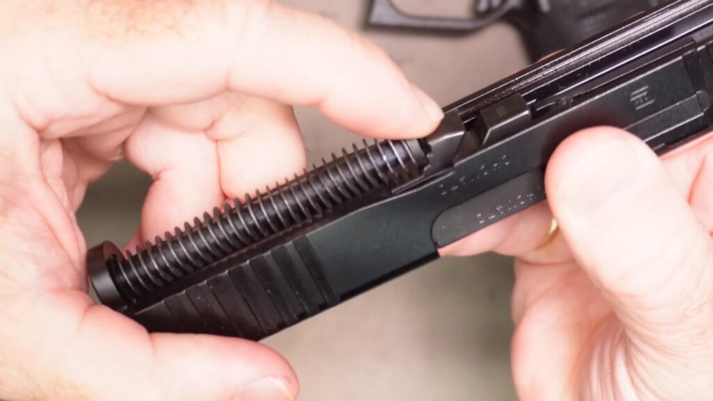 Reseat the barrel and recoil spring assembly in the slide
